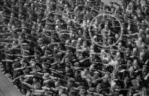 A lone man refusing to do the Nazi salute, 1936